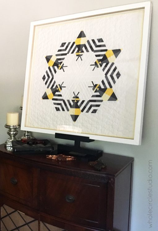 Bzzzzzz (bee) quilt framed for home, hospitality, hotel decor. Custom licensed art by Sheri Cifaldi-Morrill of Whole Circle Studio. 