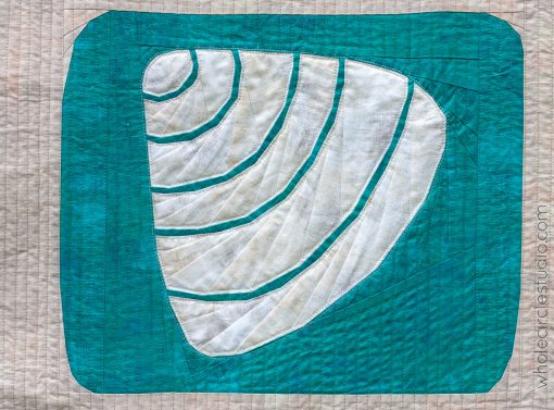 detail of Shoreline Shells quilt blocks art beach theme grid version